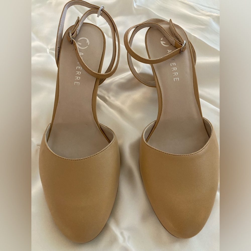 Alterre mid heel mule with interchangeable strap system.